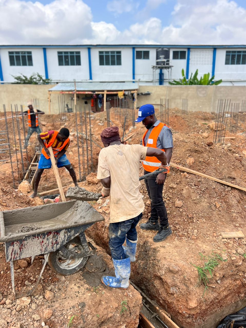 Lead engineer on site with blueprints